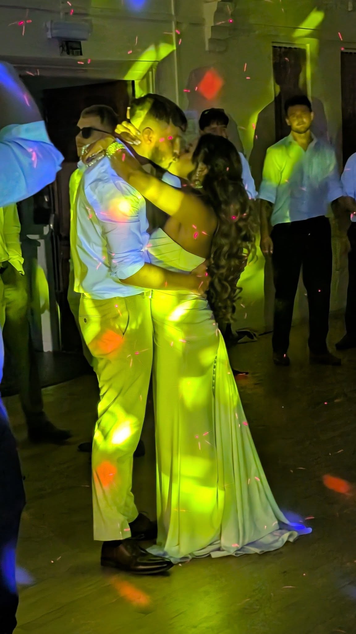Bride and groom kissing at their wedding reception